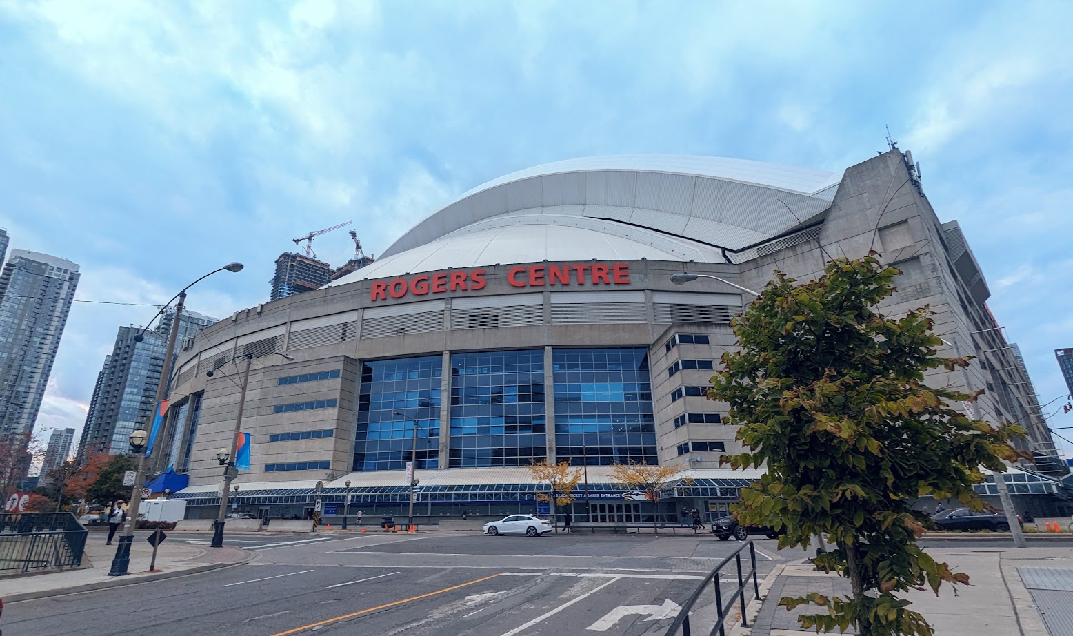 A street view of the Rogers Centre, a multi-purpose stadium located in Toronto, Canada.